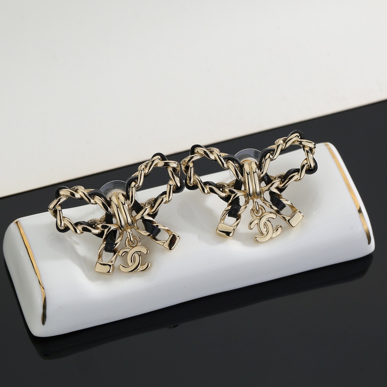 Colestore Chanel Goldtone Metal and Leather CC Bow Earrings