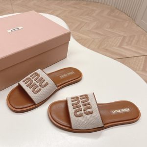 Colestore Miu Miu Canvas and leather slides Beige/Brandy